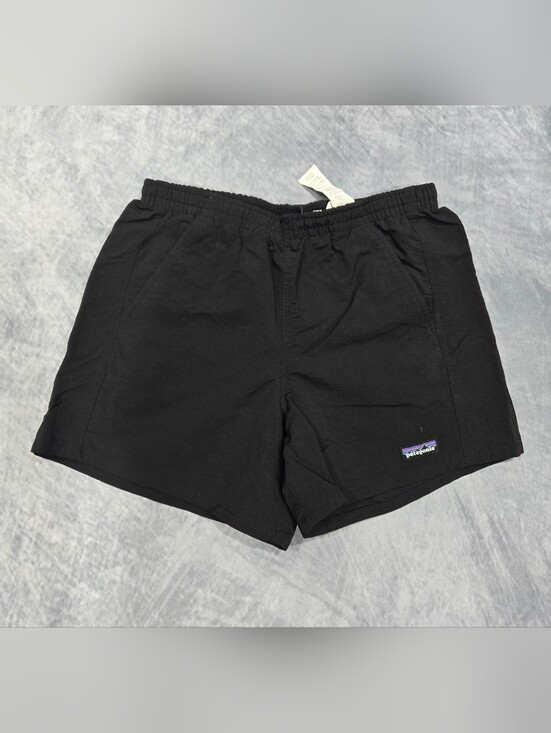 Patagonia Pants - Patagonia Baggies shorts featuring a prominent woven logo patch on the left leg.